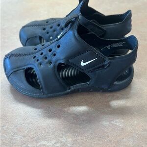 Nike Black Sandals with Adjustable Strap and Closed Toe